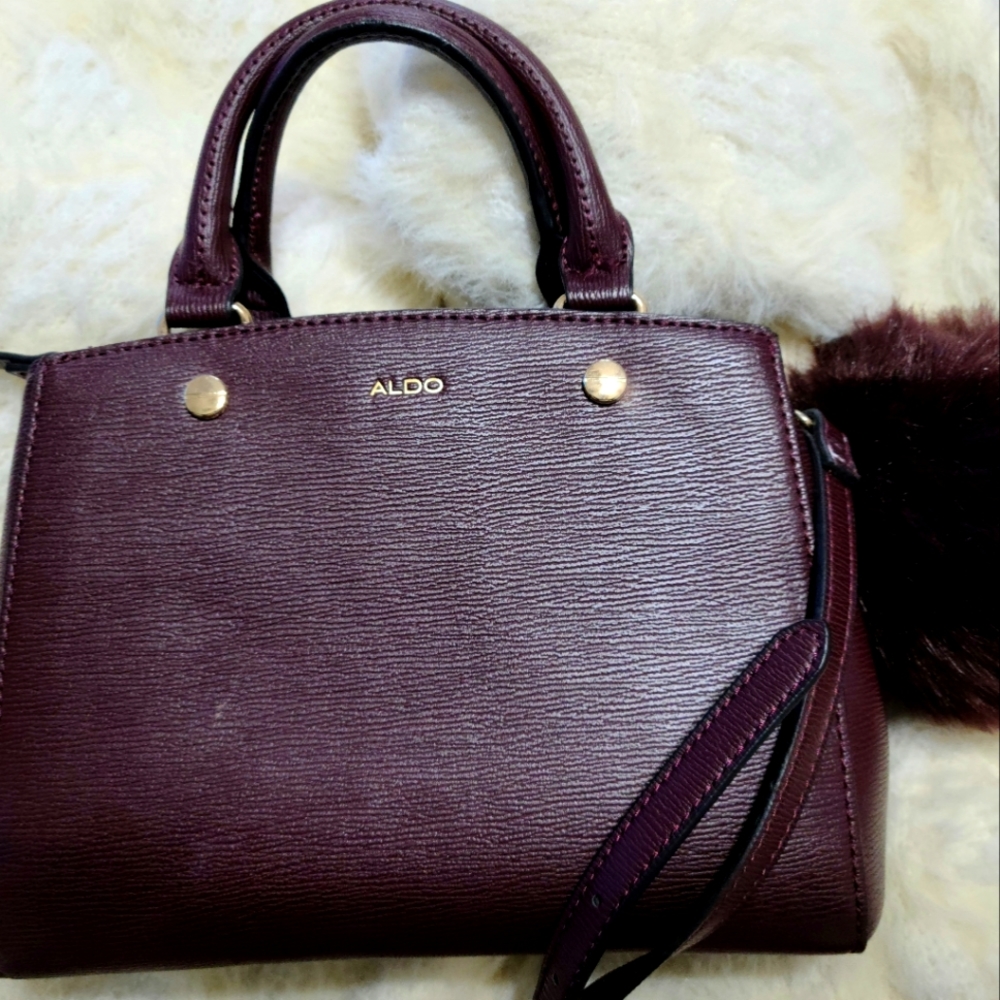 Pretty burgundy Aldo bag with a Keychain piece